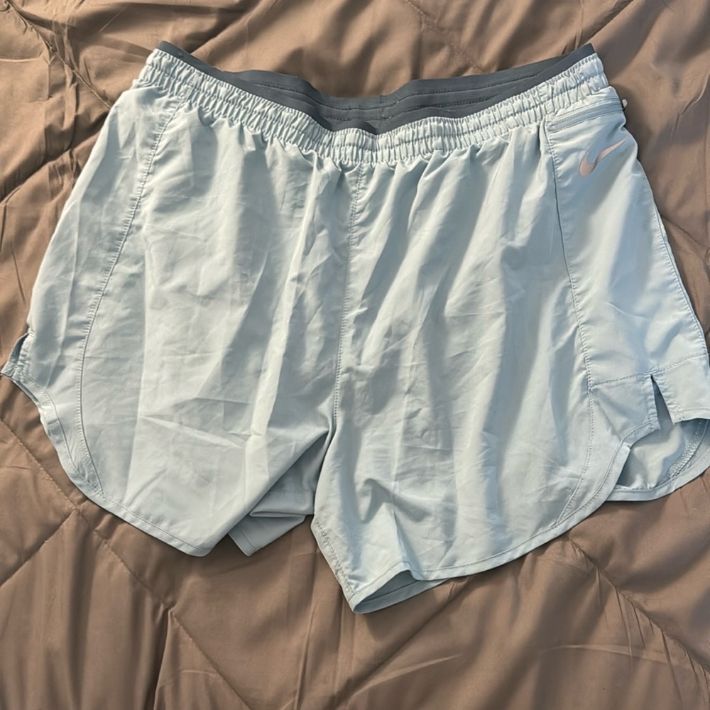 Blue Nike running shorts 4”